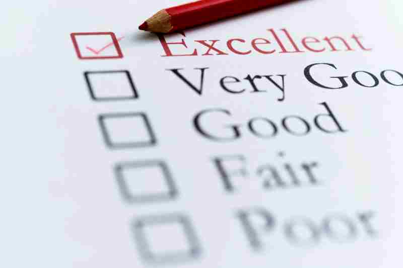 a red pencil is filling in a box labeled "excellent" on a resident satisfaction survey 