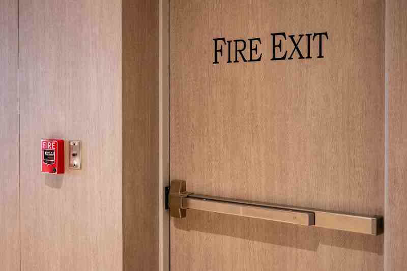 Fire alarm system near an emergency exit.
