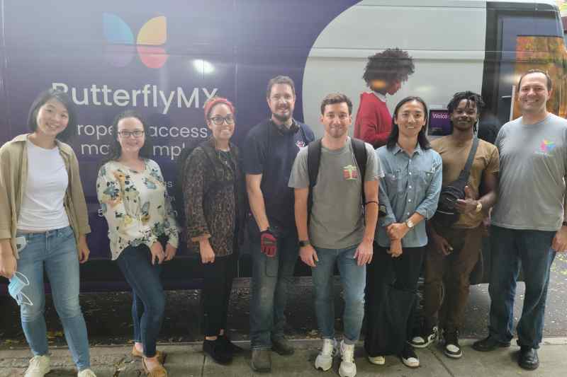 photo of butterflymx team members meeting in person