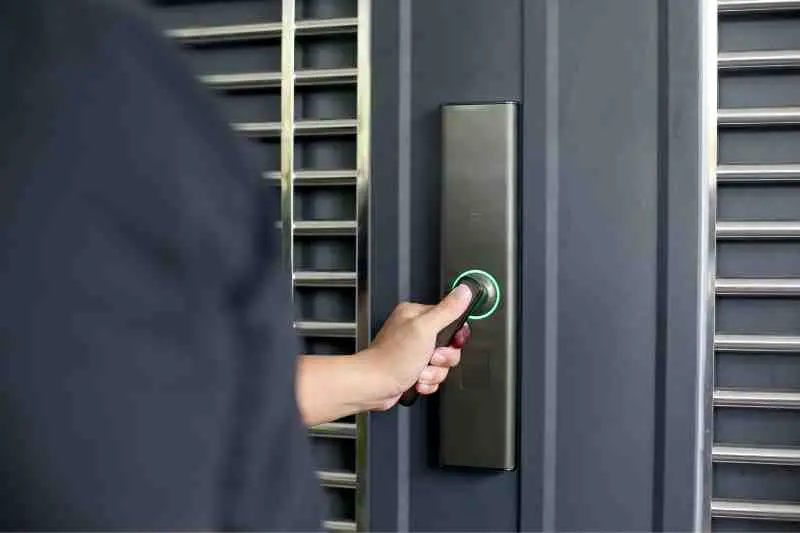 Person opening a door with wireless front door locks.