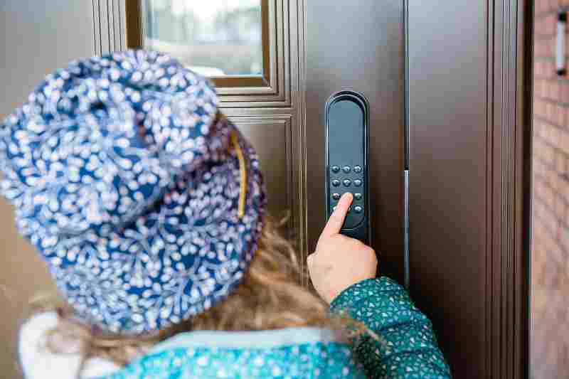resident using smart lock for door