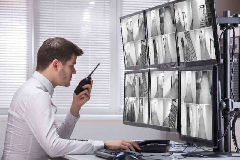 Man monitoring a property to help security companies in Louisville, KY.