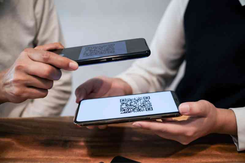 Scanning a QR code to enable seamless QR code access control.