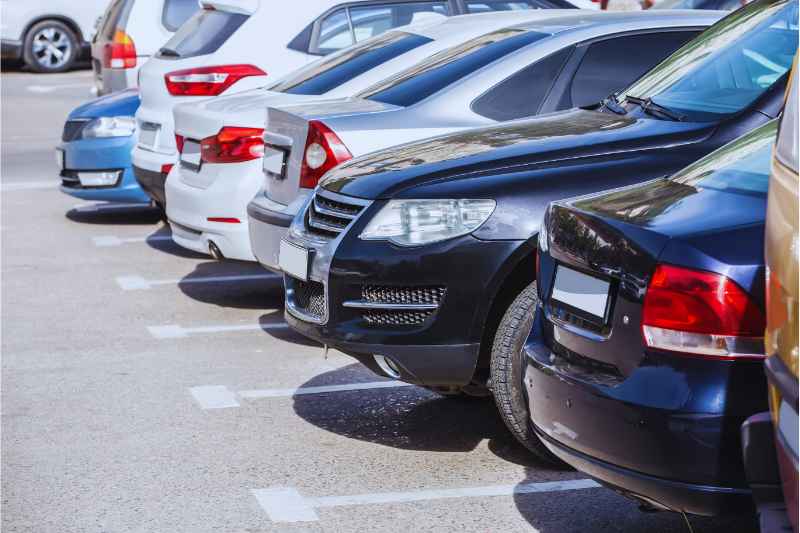 Cars parked under a condo visitor parking management system.