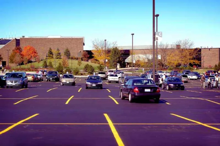 A parking lot in need of condo visitor parking management.