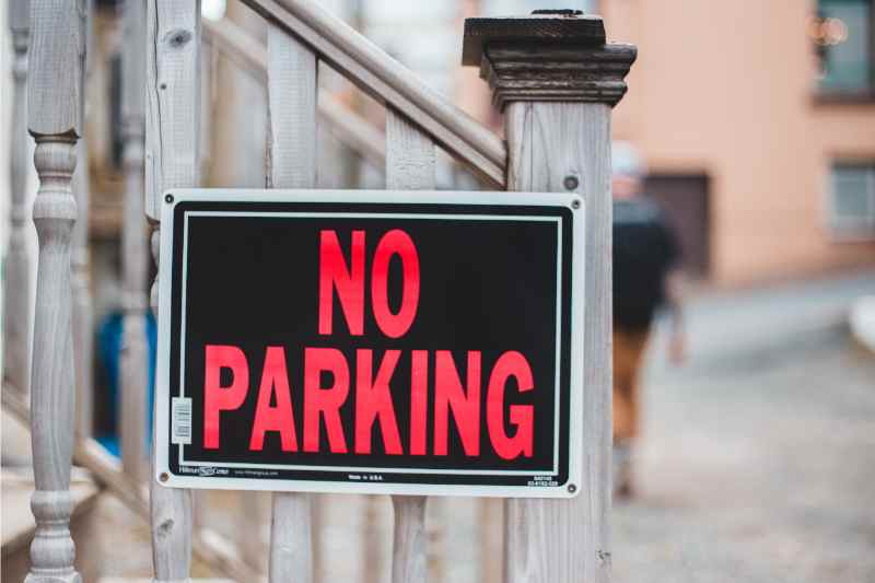 Parking signs as part of a condo visitor parking management system. 