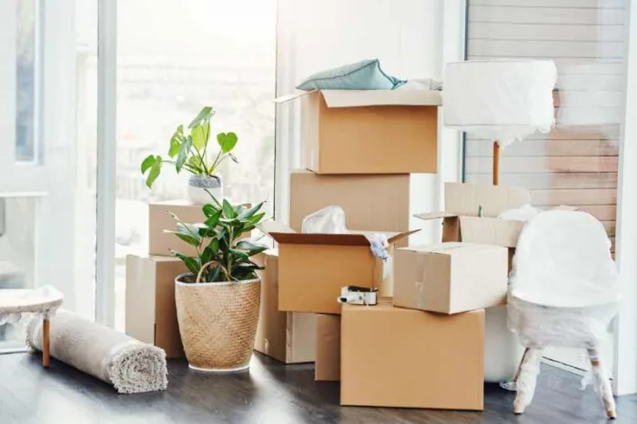 A resident piles up boxes on move-in day