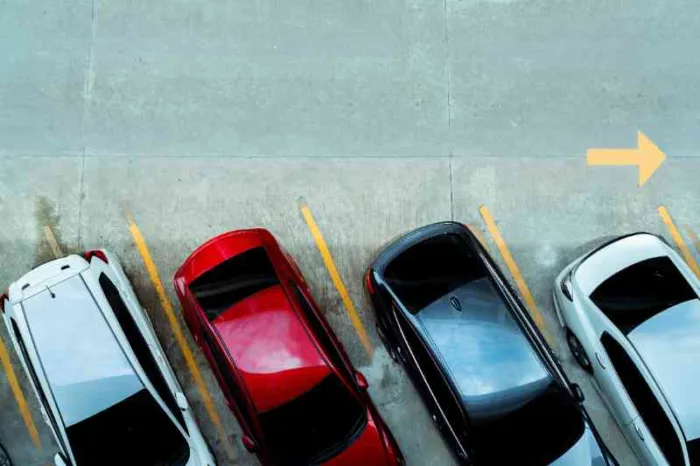 Cars using visitor parking at apartment.