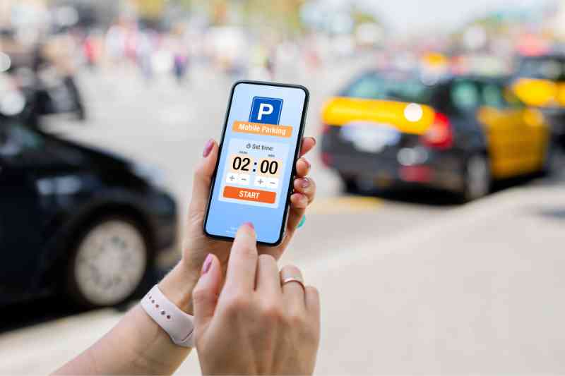 Guest using a parking app to access visitor parking apartment facilities.