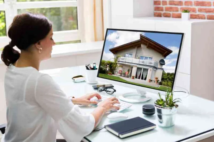 Woman using a property management software company to oversee her property.