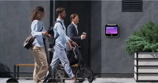 Workers walking past office building