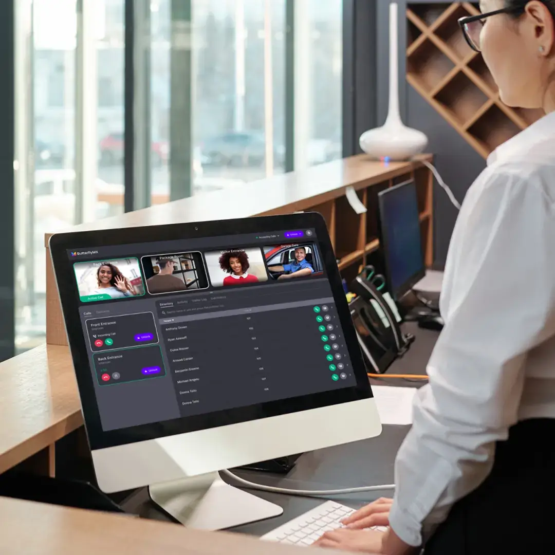 person standing at computer with ButterflyMX Front Desk Station software open