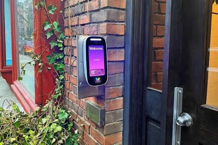 ButterflyMX 8in Video Intercom installed on a brick wall.