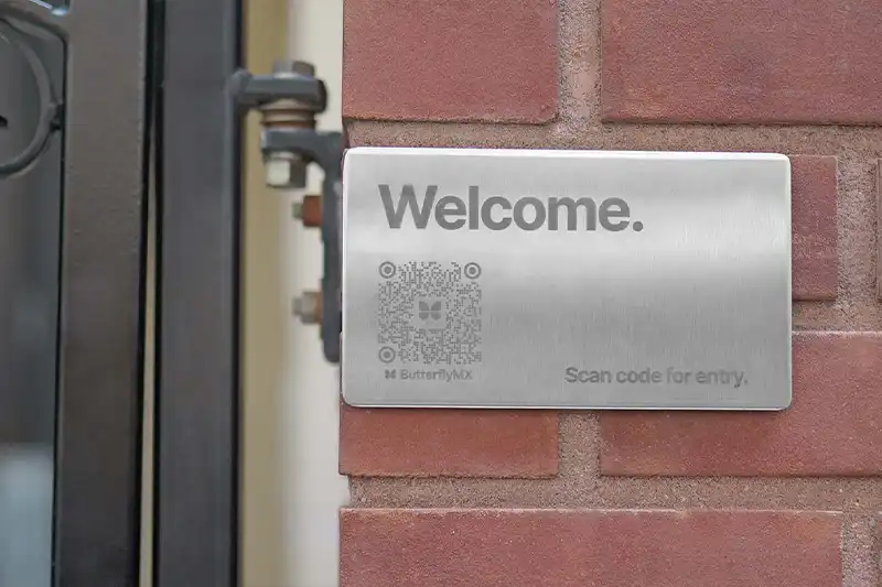 ButterflyMX QR Code Intercom installed on stone wall.