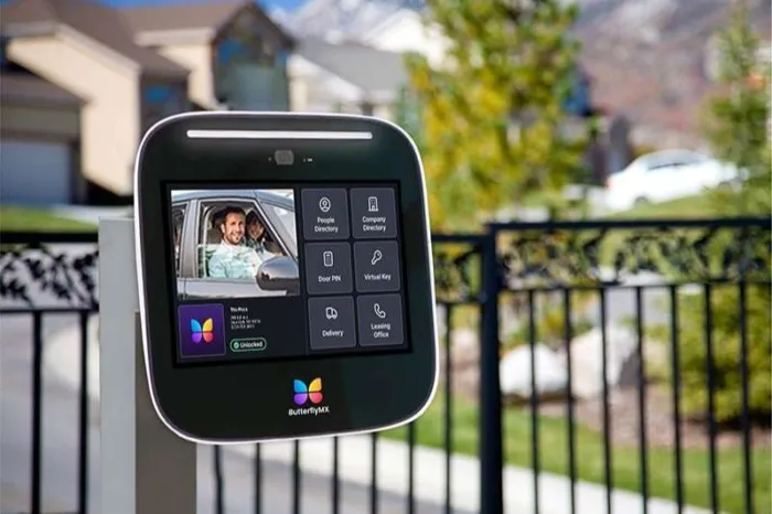 ButterflyMX Video Intercom in front of a gated community