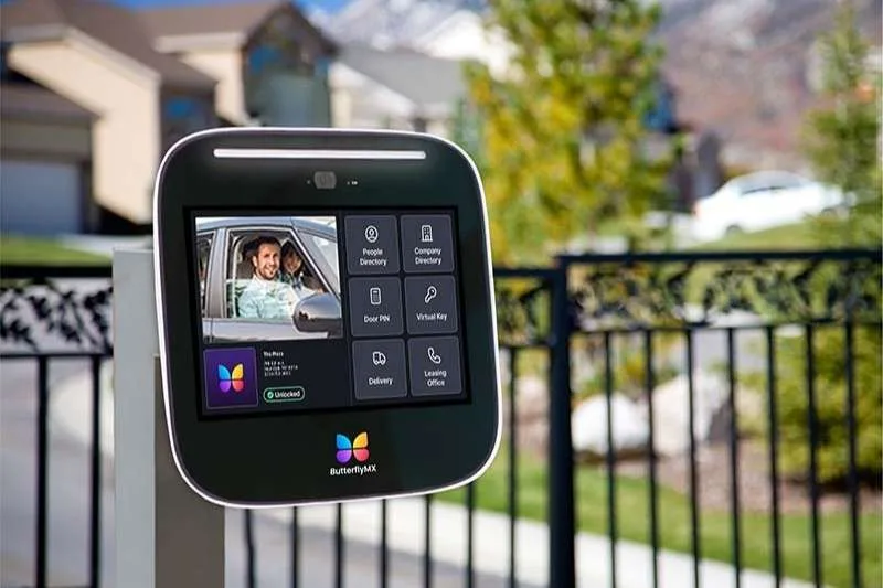 ButterflyMX Video Intercom in front of a gated community