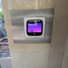 ButterflyMX 12in Video Intercom recessed install on a tiled wall.