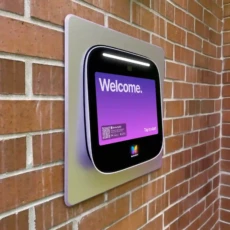 Recessed video intercom installed in a brick wall