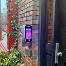 ButterflyMX 8in Video Intercom installed on a brick wall.
