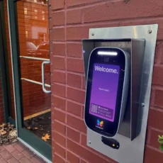ButterflyMX 8in Video Intercom installed on a brick wall.